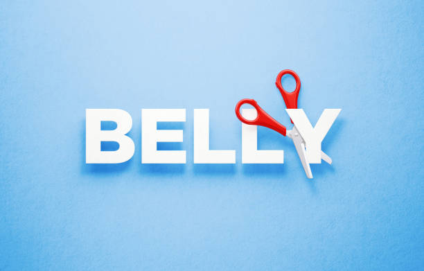 istock Losing Belly Fat Concept - Scissors Cutting The Word Belly Over Blue Background 1313128045
