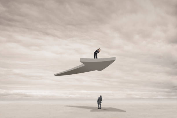 istock Man Looking Up At Woman Riding On Arrow 1313130156