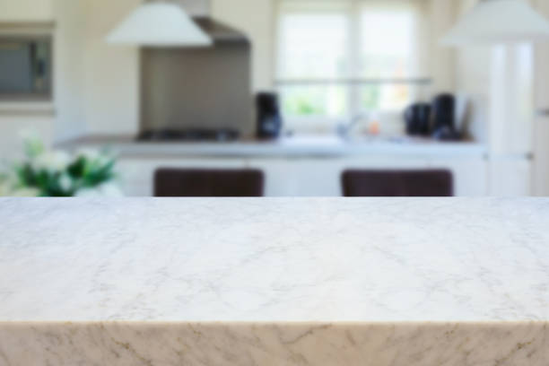 istock Empty marble table over kitchen interior background.  Mock up for design and product display. 1313132492