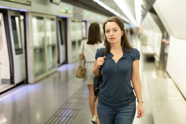 istock Woman waiting for train at underground station 1313134952