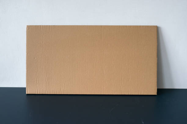 istock Cardboard card on the table by the wall 1313138499