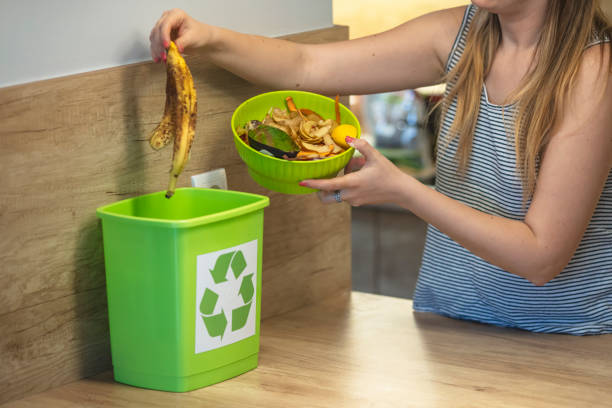 istock The responsible woman throws organic trash into the bin for compost 1313138538