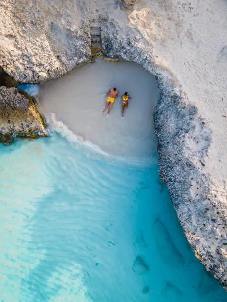 Photo of Tres Trapi Steps Triple Steps Beach, Aruba completely empty, Popular beach among locals and tourists, crystal clear ocean Aruba