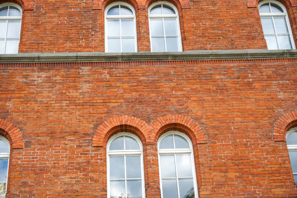 istock Old wooden frame and broken glass window on an old building for renovation 1313139308