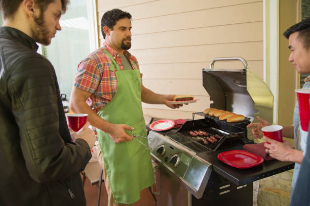 istock Multi ethnic group of young men at a cook out. 1313140055