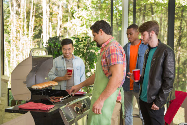 istock Multi ethnic group of young men at a cook out. 1313140061