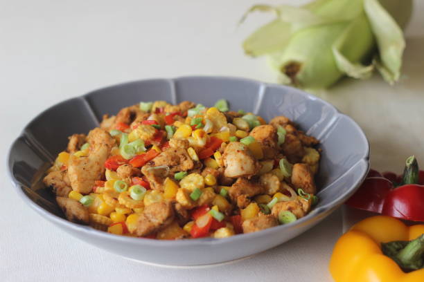 sauteed chicken, sweet corn, baby corn, spring onions and bell peppers. a healthy and quick lunch - fine dining grilled spring onion healthy lifestyle imagens e fotografias de stock
