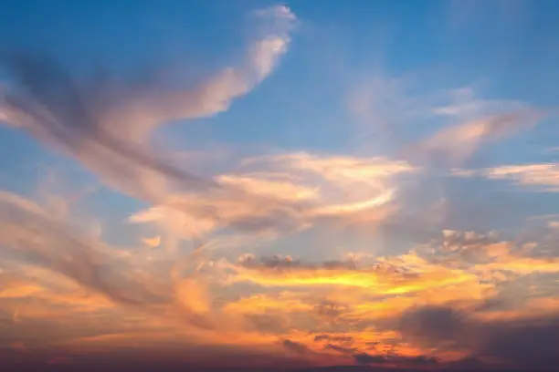 Beautiful sky at golden hour twilight. Amazing colorful and cloudy sky