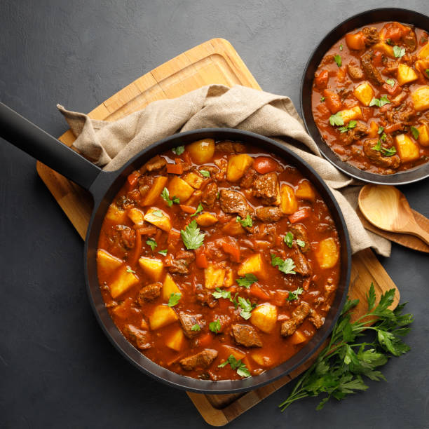 istock Goulash, beef stew with vegetables in tomato sauce 1313149341