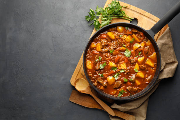 istock Goulash, beef stew with vegetables in tomato sauce 1313149400