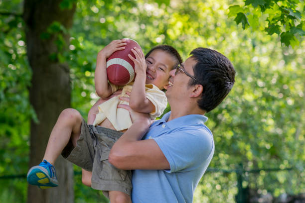istock Playing Football Together 1313152438