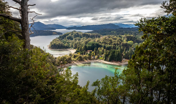 view of the narrow port of villa la angostura from the viewpoint of the arrayanes park. - bariloche patagonia argentina lake imagens e fotografias de stock