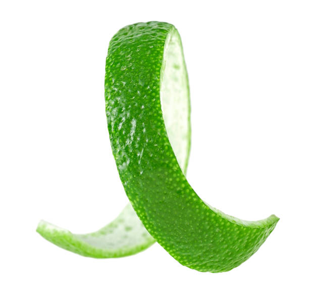 istock Lime fruit peel isolated on a white background. Curly lime twist. 1313159200
