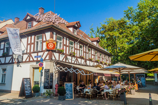 ERLANGEN, GERMANY - SEPTEMBER 15, 2016: Old traditional half timbered house with a restaurant in Erlangen, Germany