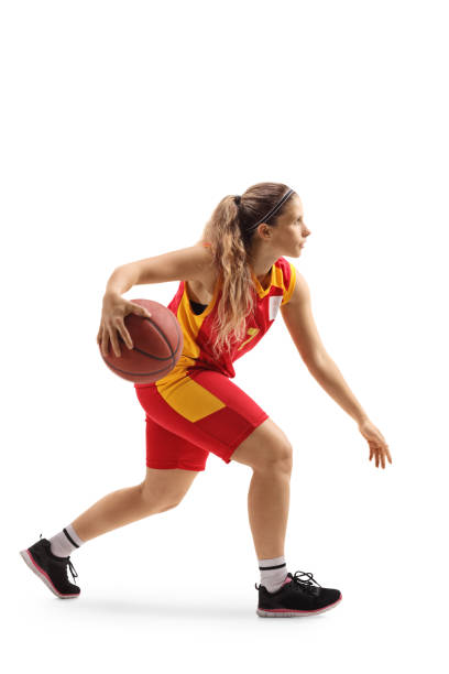 istock Female basketball player leading a ball 1313165270