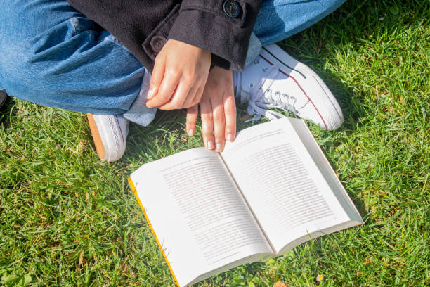 istock No identity woman reading a book 1313167705