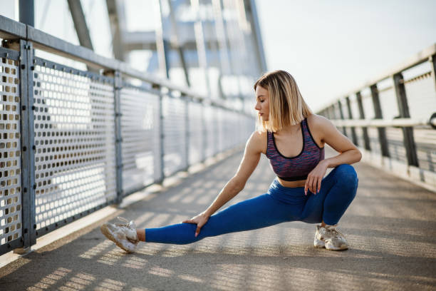istock Young woman jogging outdoors in springtime 1313167804