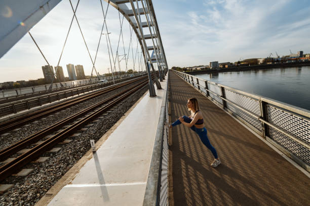 istock Young woman jogging outdoors in springtime 1313168190