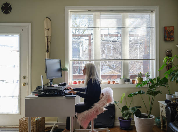 istock Mature woman working on computer from home 1313171724