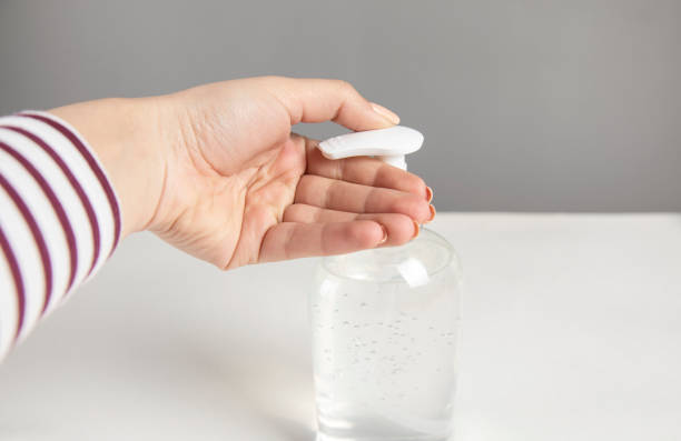 istock Woman hand using alcohol wash gel 1313174426