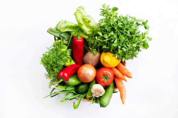 istock Fresh Vegetables in basket on white isolated background top view. 1313179087
