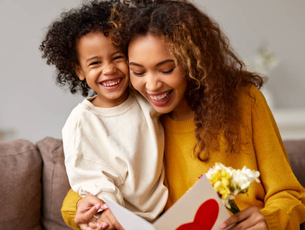 istock Young mixed race woman getting congratulations from son on Mothe 1313180363