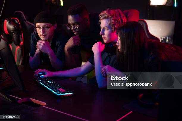 Players Of The Esports Team Gathered Together In The Computer Club And Watch The Stream From The Dota 2 World Championship Stock Photo - Download Image Now