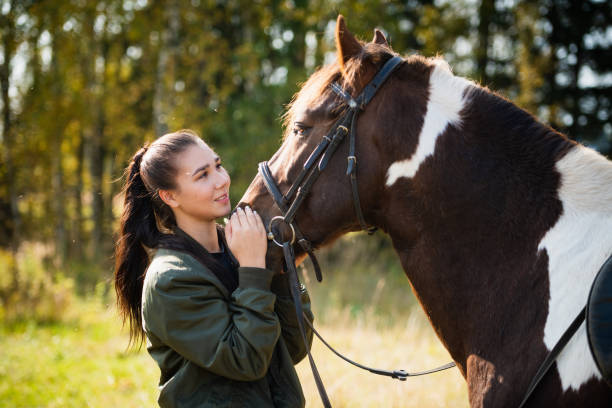 istock Tender communication between a rider and her horse before a riding lesson 1313182882