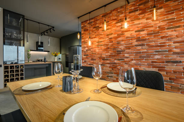 istock Modern luxurious dark gray and black kitchen with dining table 1313182917