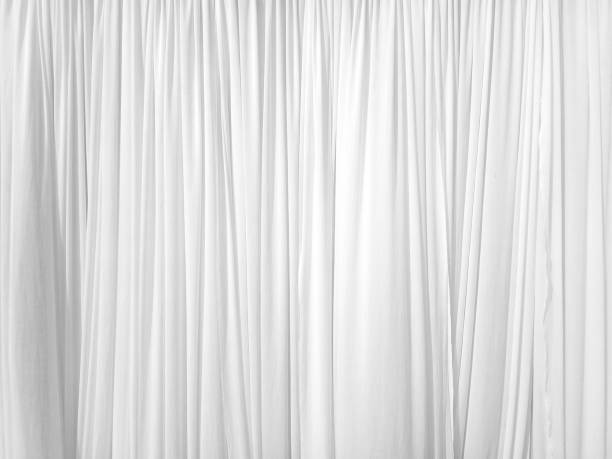 istock Soft white curtains are simple yet elegant for graphic design or wallpaper. 1313186135