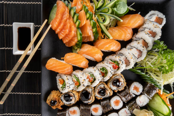 istock Mixed sushi roll and salmon sashimi 1313191168
