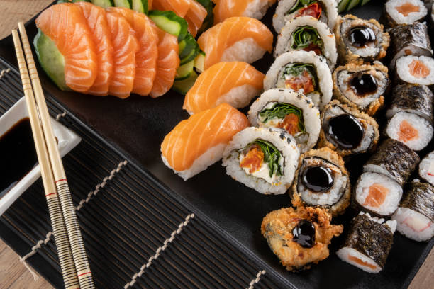 istock Mixed sushi roll and salmon sashimi 1313191188