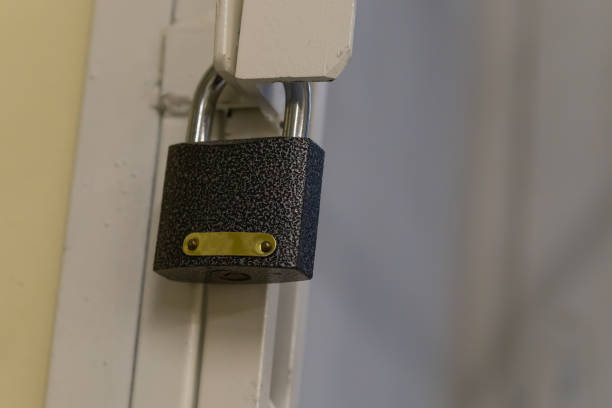 istock iron lock on a background of a lattice with copy space close-up 1313192168
