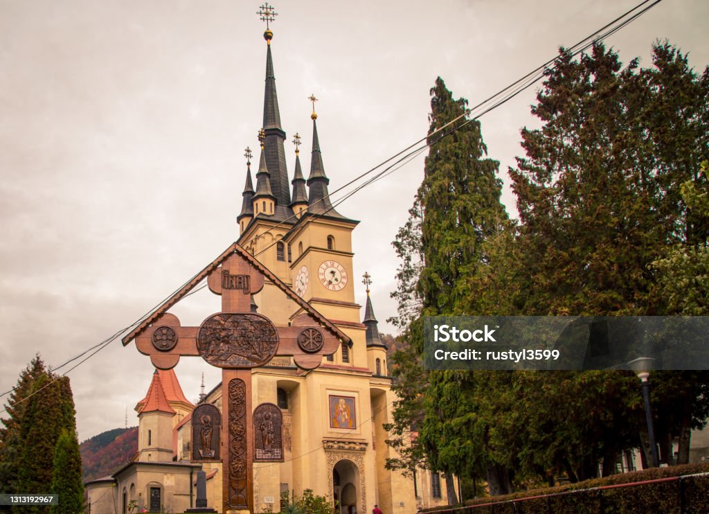 Orthodox wooden cross and Church Orthodox wooden cross and Church in Romania Architecture Stock Photo