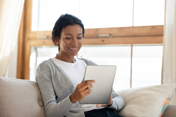 istock Happy young african american biracial woman using digital computer tablet. 1313193668