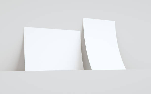 istock A4 Flyer / Letterhead Mock-Up - Two Flyers Against Wall Background 1313194183