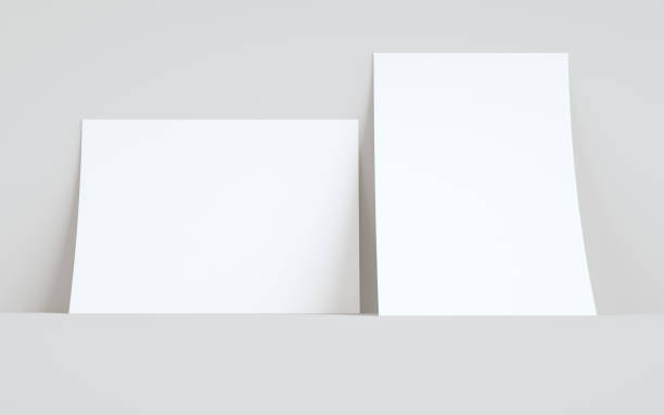 istock A4 Flyer / Letterhead Mock-Up - Two Flyers Against Wall Background 1313194184