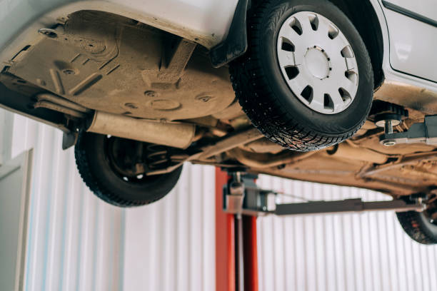 istock Car lifted on car lift for routine maintenance 1313194245