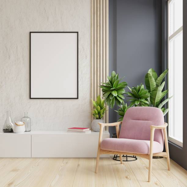 istock Poster mockup with vertical frames on empty wall in livingroom interior with pink velvet armchair. 1313196946