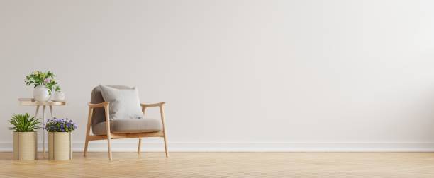 istock Modern minimalist interior with an armchair on empty white wall background. 1313196958