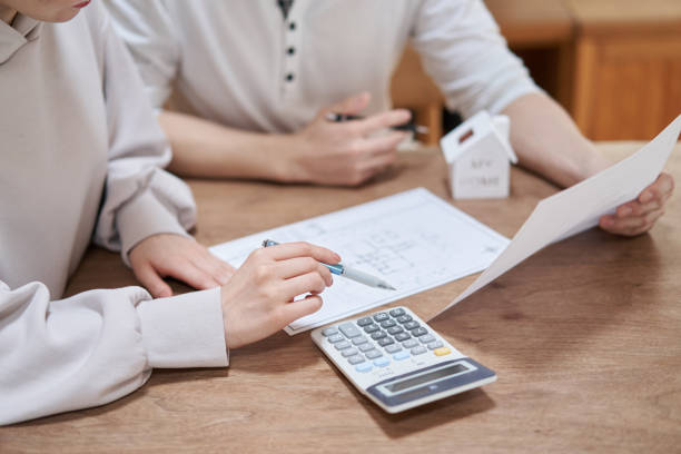 Asian couple thinking about buying a home