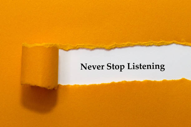 istock Never Stop Listening Written Under Orange Torn Paper 1313205176