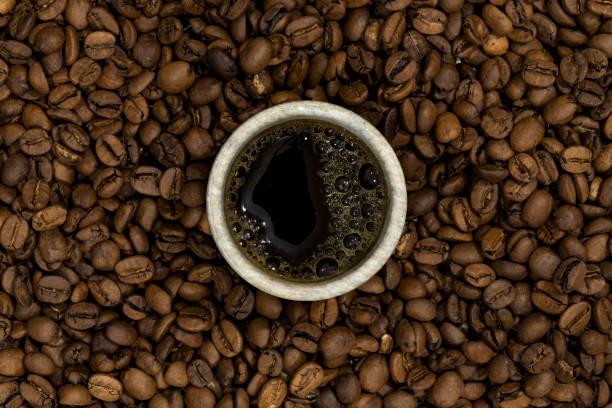 Coffee bean background, roast grain. Top view. Macro photography, detailed image. coffee table top stock pictures, royalty-free photos & images