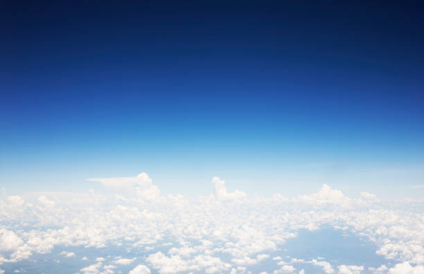 istock Blue sky background and white clouds soft focus, top view take a picture on airplane. 1313206422