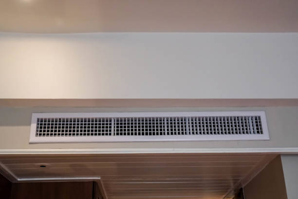air conditioner at the wall in hotel room stock photo