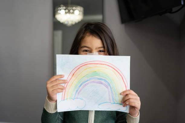 istock Girl holding her new drawing 1313208971