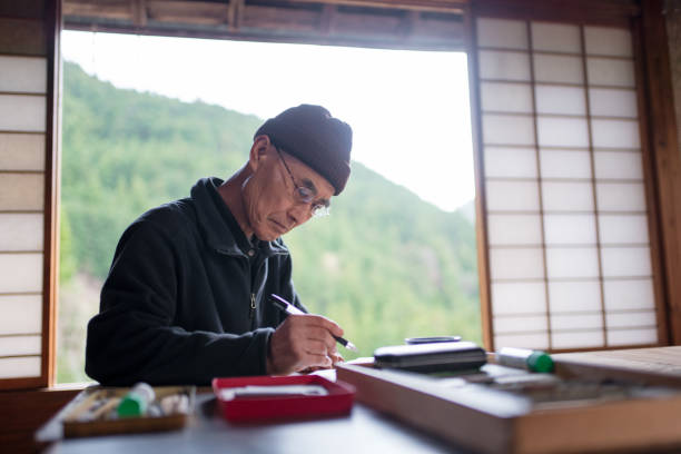 istock Senior Japanese artist in his studio 1313211360