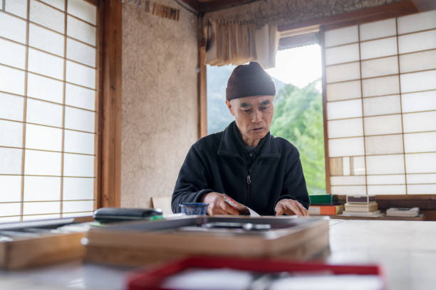 istock Senior Japanese artist in his studio 1313211504