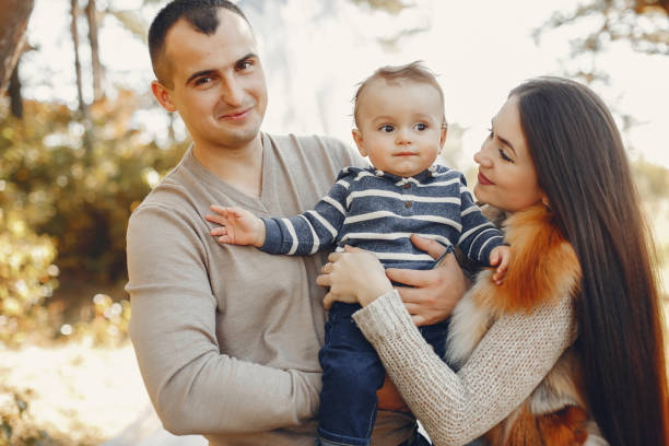 istock Cute family playing in a summer park 1313213063