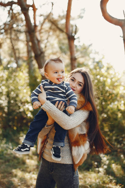 istock Mother with son playing in a summer park 1313213096